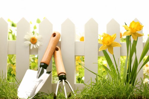 Safe and tidy landscaping worksite with barriers and tools stored